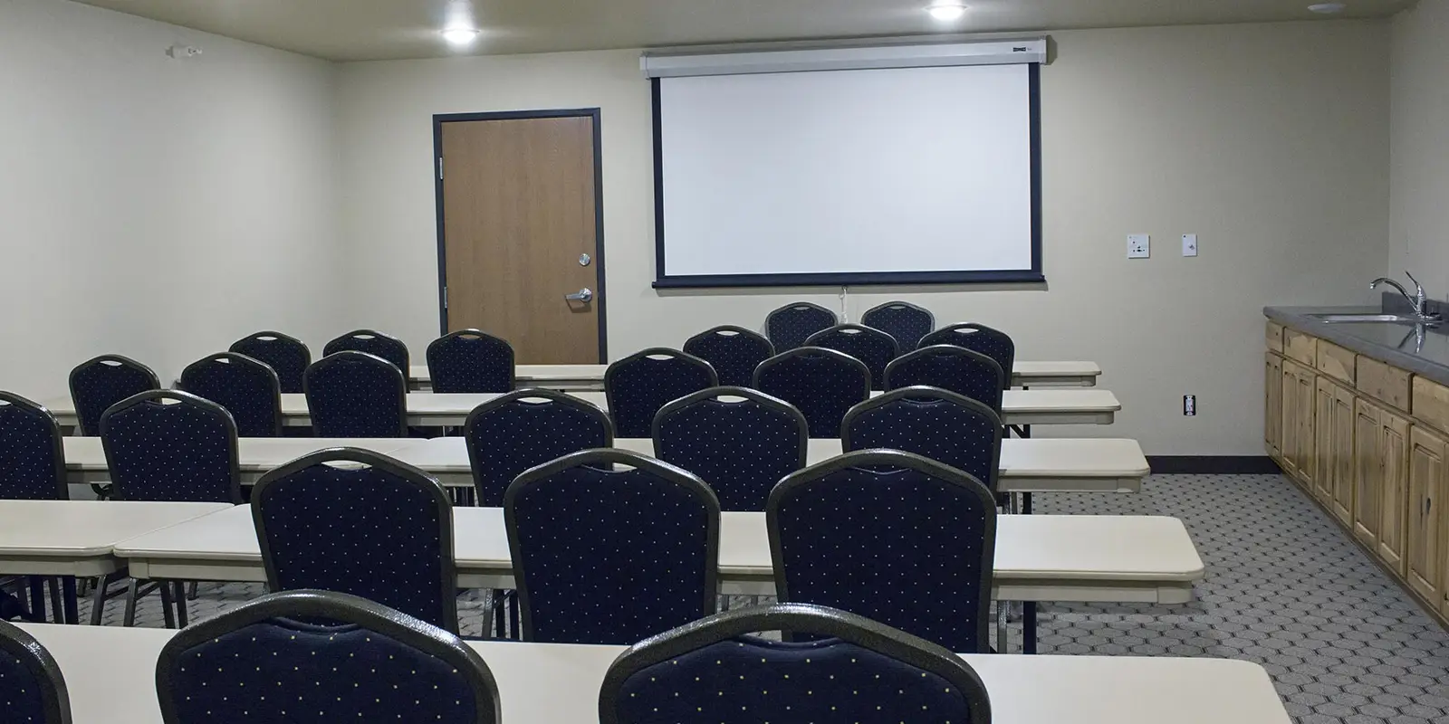 banquet room with projection screen