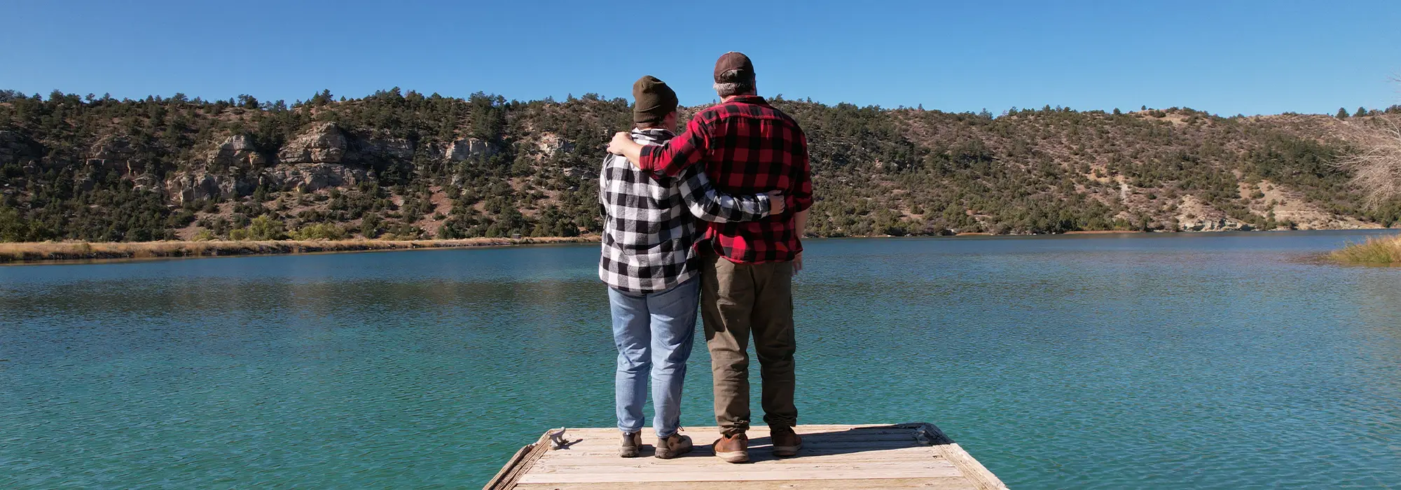 couple standing on dock